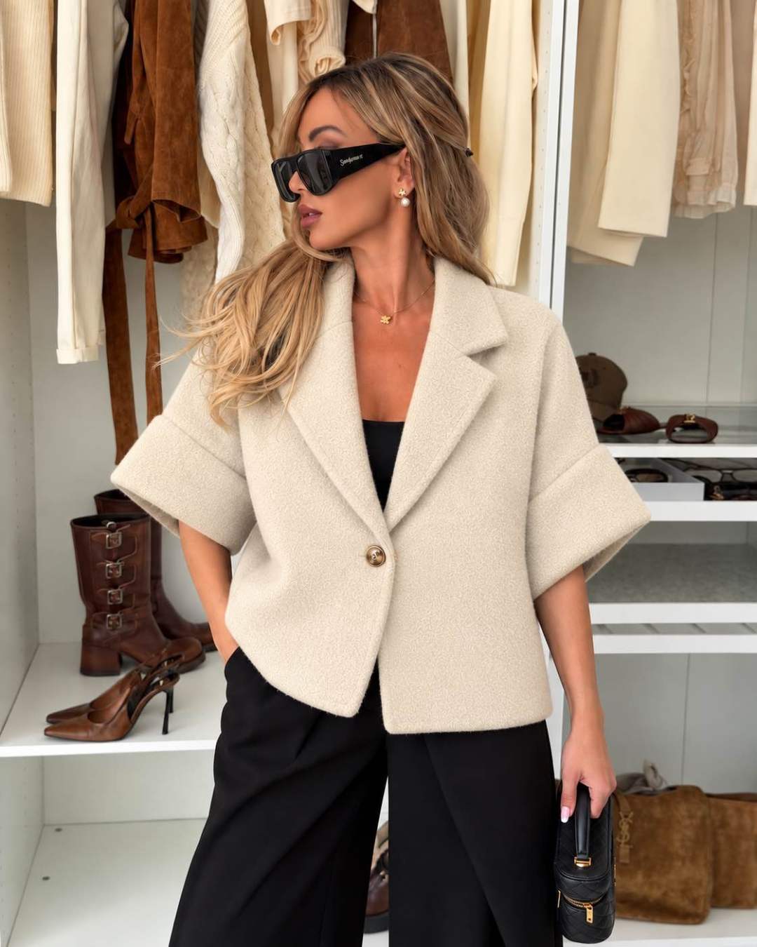 Veste courte effet laine bouclée à manches courtes et bouton