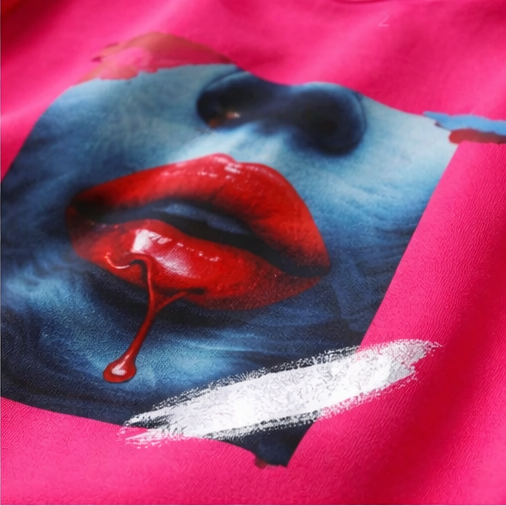 Tee shirt Taille L/XL coloris rose fushia a motifs